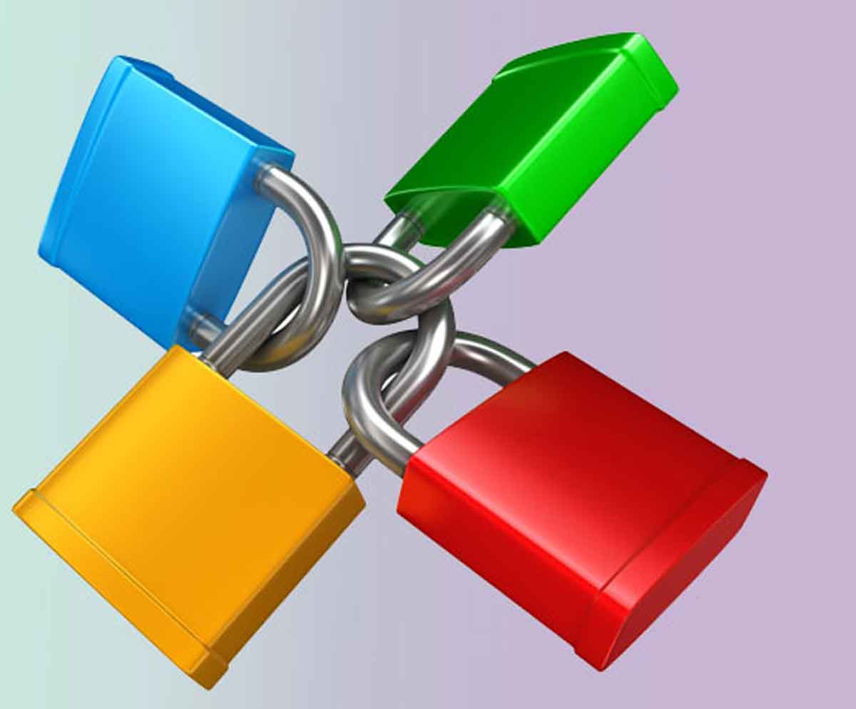 Four padlocks of blue green red and yellow locked together to form a square
